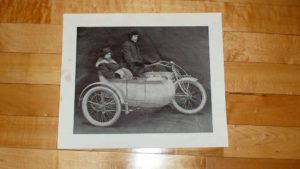 vintage art: Aged black and white drawing of a motorcycle with sidecar