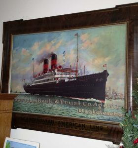 vintage art: A grand ship painting adorning a wall, showcasing a majestic vessel navigating through the ocean.