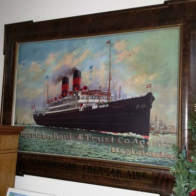 vintage art: A grand ship painting adorning a wall, showcasing a majestic vessel navigating through the ocean.